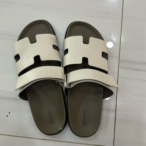 Hermès Chypre Leather Slides
Man.  white and grey